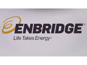 The Enbridge logo is shown at the company's annual meeting in Calgary on May 9, 2018. Enbridge Gas Distribution Ltd. says its typical residential customer's natural gas bill will go down about $29 a year.THE CANADIAN PRESS/Jeff McIntosh