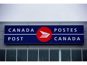 The Canada Post logo is seen on the outside the company's Pacific Processing Centre, in Richmond, B.C., on June 1, 2017. While postal workers waited Monday to find out whether they'll be on picket lines later this month, some of Canada Post's clients weren't taking chances on whether there would be a strike or lockout at the Crown agency.