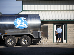 A milk transport truck collects milk from a dairy farm in Caledonia, Ontario.