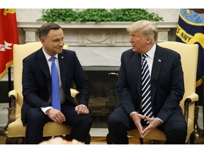 President Donald Trump talks with Polish President Andrzej Duda during a meeting in the Oval Office of the White House, Tuesday, Sept. 18, 2018, in Washington.