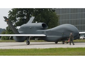 FILE-- In this Thursday, July 21, 2011 photo a recce drone 'Euro Hawk' is moved at the air base in Manching, Germany. Germany wants to sell a second-hand drone that's cost the country over 700 million euros ($823 million) to Canada, without many core components it needs to fly.