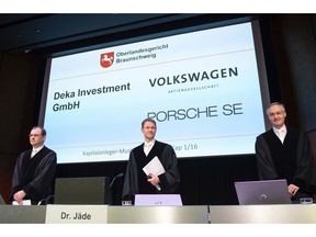 Judges Nicolai Stephan,  Christian Jaede and Friedrich Hoffmann, from left, arrive for the opening of a lawsuit against Volkswagen on compensation for the losses of shareholders caused by the Diesel scandal at the higher regional court in Braunschweig, northern Germany, Monday, Sept. 10, 2018.