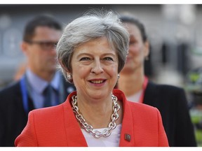 British Prime Minister Theresa May smiles when arriving at the informal EU summit in Salzburg, Austria, Thursday, Sept. 20, 2018.