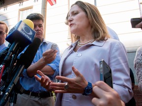 Canadian Foreign Affairs Minister Chrystia Freeland speaks to media during NAFTA negotiations in Washington. A source said Friday Canada is increasingly optimistic it can reach a deal with the United States, but it may take until the end of September.