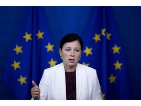 EU Consumer Commissioner Vera Jourova talks to journalists during a news conference at the European Commission headquarters in Brussels, Thursday, Sept. 20, 2018. European Union officials say Airbnb has agreed to clarify its pricing and booking system in response to complaints that they could mislead consumers.