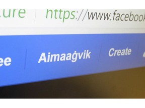 This Thursday, Aug. 23, 2018 photo shows a computer screen with Facebook's new Inupiat Eskimo language option, which shows the Inupiaq word for home in Anchorage, Alaska. The Inupiaq option now available for Facebook bookmarks, action buttons and other interface functions was added after Alaskans made it a reality through the social media giant's community translation tool.