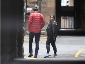 Minister of Foreign Affairs Chrystia Freeland and Gerald Butts, senior political advisor to Prime Minister Justin Trudeau, walk in the loading dock of the Office of the Prime Minister and Privy Council, in Ottawa on Sunday, Sept. 30, 2018.