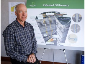 Enhance Energy CEO Kevin Jabusch's company has signed a deal to work on the Alberta Carbon Trunk Line project designed to capture CO2 and he is seen with a diagram of the project at his office in Calgary, Alta., Thursday, Aug. 23, 2018.