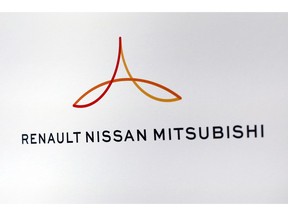 FILE - This Friday Sept. 15, 2017 file photo shows the new logo of the Renault-Nissan-Mitsubishi alliance during a press conference in Paris, France. Renault-Nissan-Mitsubishi said Tuesday Sept. 18, 2018 that Google is teaming up with Renault-Nissan-Mitsubishi to add the search giant's Android mobile operating system to the auto alliance's dashboard media systems.