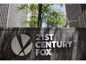 FILE - In this file photo dated Thursday, June 14, 2018, the 21st Century Fox logo is shown outside its New York office.   British regulators say that the corporate battle between 21st Century Fox and Comcast to take over broadcaster Sky will be settled by auction, commencing at 5 p.m. on Sept. 21 and ending on the evening of Sept. 22, 2018.