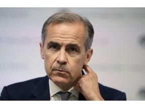 FILE - In this file photo dated Wednesday, June 27, 2018, Mark Carney the Governor of the Bank of England, during a press conference to deliver the Financial Stability Report at the Bank of England in the City of London.  Carney all but confirmed Tuesday Sept. 4, 2018, to a committee of lawmakers, that he is to stay at the helm of the central bank for longer than the planned June 2019 departure, to help ensure Britain leaves the European Union as smoothly as possible.