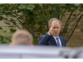 Former President George W. Bush leaves after speaking at the memorial service for Rich DeVos at La Grave Christian Reformed Church in Grand Rapids, Mich., on Thursday, Sept. 13, 2018.