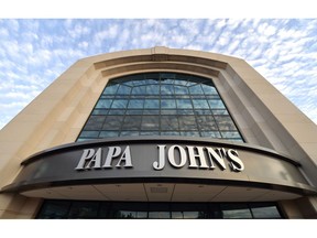 FILE - This July 17, 2018, file photo, shows the corporate headquarters of Papa John's pizza located on their campus, in Louisville, Ky.  Papa John's, which wants to distance itself from famous founder John Schnatter, is releasing new ads Tuesday, Sept. 18, that replaces him with a diverse group of franchisees.