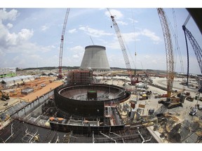 FILE- This June 13, 2014, file photo, shows construction on a new nuclear reactor at Plant Vogtle power plant in Waynesboro, Ga. A group of Georgia lawmakers wants a "cost cap" in the construction of a nuclear power plant near Augusta to protect blown budgets from being passed on to consumers. Two reactors being built at Plant Vogtle are billions of dollars over budget.