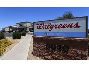 FILE - This June 25, 2018 file photo shows Walgreens in Peoria, Ariz. The Securities and Exchange Commission is charging Walgreens, as well as former CEO Gregory Wasson and former Chief Financial Officer Wade Miquelon, with misleading investors about increased risk that the company would miss a key earnings goal announced when it entered a merger deal with Alliance Boots six years ago.