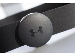 FILE - In this Monday, Jan. 4, 2016, file photo, an Under Armour chest strap heart rate monitor is displayed in New York. Under Armour is reducing its global workforce by 3 percent by the end of March, the athletic apparel maker said Thursday, Sept. 20, 2018.