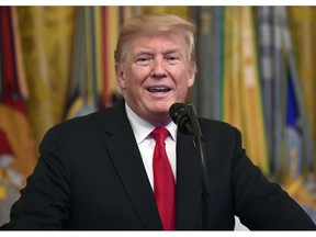 FILE - In this Sept. 12, 2018, file photo, President Donald Trump speaks during a Congressional Medal of Honor Society Reception in the East Room of the White House in Washington.