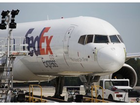 FILE- In this April 18, 2017, file photo, a FedEx cargo plane sits idle during the day at Richmond International Airport in Sandston, Va. FedEx Corp. reports earnings Monday, Sept. 17, 2018.