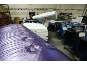 In this July 5, 2018, photo workers assemble the Afloat water mattresses at the factory in Corona, Calif. Two pioneers of the waterbed industry in the United States, are hoping to generate a new wave of popularity for the old furniture concept by using a wholesome new pitch.