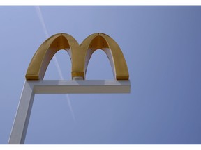 FILE- This Aug. 8, 2018, file photo shows the logo of McDonald's at flagship restaurant in Chicago. McDonald's workers are going on strike next week. Emboldened by the #MeToo movement, McDonald's workers have voted to stage a one-day strike next week at restaurants in 10 cities. Plans are for the walkout to start lunchtime on Sept. 18.