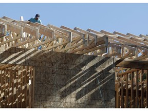 FILE- In this Thursday, Aug. 30, 2018, file photo, a worker toils on a new home under construction in Denver. On Wednesday, Sept. 19, the Commerce Department reports on U.S. home construction in August.
