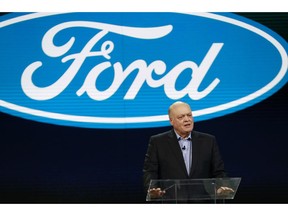 FILE- In this Jan. 14, 2018, file photo Ford President and CEO Jim Hackett prepares to address the media at the North American International Auto Show in Detroit. Hackett said Wednesday, Sept. 16, during a television interview that the Trump administration's tariffs on imported steel and aluminum will cost the company $1 billion.
