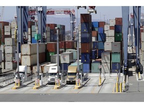 FILE- In this Aug. 22, 2018, file photo cargo is unload from trucks at the Port of Long Beach in Long Beach, Calif. On Wednesday, Aug. 5, the Commerce Department reports on the U.S. trade gap for July