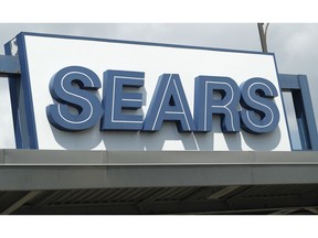 In this Saturday, July 21, 2018, photo the outdoor sign stands in the parking lot of a Sears department store in Saint Paul, Minn. Sears Holdings Corp. reports earns Thursday, Sept. 13.