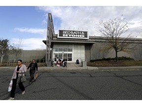 FILE- In this Oct. 25, 2017, file photo shoppers walk toward their vehicles outside of a Bed Bath & Beyond department store at Jersey Gardens Mall in Elizabeth, N.J. Bed Bath & Beyond's stock plunged to its lowest price in 18 years after the home goods store chain posted weak results in the second quarter and cut its forecasts for the rest of the year. The company's profit fell by almost 50 percent compared to a year ago.