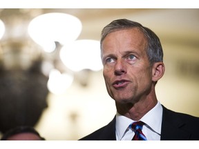 FILE - In this Sept. 5, 2018, file photo, Sen. John Thune, R-S.D., speaks with reporters after the Republican's policy luncheon on Capitol Hill in Washington. The Trump administration is hoping Congress can come up with a new set of national rules governing how companies can use consumers' data that finds a balance between "privacy and prosperity." "Consumers deserve clear answers and standards on data privacy protection," Thune, who heads the Commerce panel, said in a statement. By hearing from the companies, lawmakers will be able to assess "what Congress can do to promote clear privacy expectations without hurting innovation," he said.