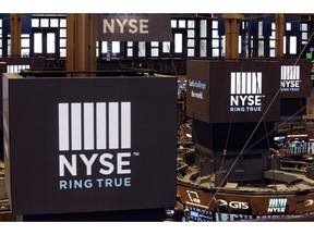 FILE- In this Aug. 21, 2018, file photo screens above trading posts on the floor of the New York Stock Exchange show the NSE logo. The U.S. stock market opens at 9:30 a.m. EDT on Tuesday, Sept. 4, 2018.
