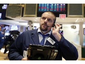 FILE- In this Sept. 14, 2018, file photo trader Michael Milano works on the floor of the New York Stock Exchange. The U.S. stock market opens at 9:30 a.m. EDT on Thursday, Sept. 20.