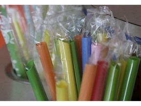 FILE - This July 17, 2018 file photo shows wrapped plastic straws at a bubble tea cafe in San Francisco. A law signed Thursday, Sept. 20, 2018, by Gov. Jerry Brown makes California the first state to bar full-service restaurants from automatically giving out single-use plastic straws. It takes effect next year.