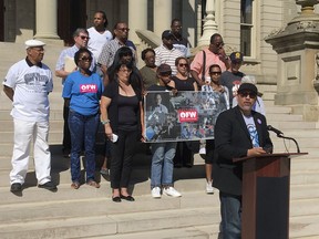 Pete Vargas, campaign manager for the One Fair Wage ballot initiative that would raise Michigan's minimum wage, speaks at a news conference on Tuesday, Sept. 4, 2018, on the steps of the state Capitol in Lansing, Mich. The group opposes a potential Republican legislative strategy to adopt the initiative, then amend it later in the year.