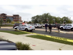 Emergency personnel arrive at the scene where a shooting was reported at a software company in Middleton, Wis., a suburb of Madison, Wednesday, Sept. 19, 2018. Multiple people were reported to have been shot.