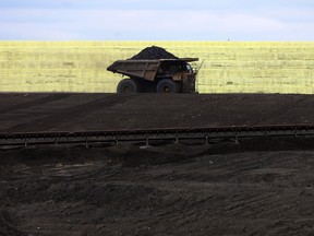 A truck passes a huge pile of sulphur at the Syncrude mine near Fort McMurray, Alberta.