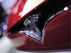 Tesla Inc Chief Accounting Officer Dave Morton resigned on Tuesday, citing discomfort with the level of public attention in the company and pace of work just a month after he joined the electric car maker.