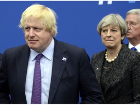 FILE - In this Thursday, May 25, 2017 file photo British Foreign Secretary Boris Johnson, left, and Britain's Prime Minister Theresa May arrive for a meeting during the NATO summit of heads of state and government, at the NATO headquarters, in Brussels. British ex-Foreign Secretary Boris Johnson has slammed Prime Minister Theresa May's Brexit policy, a move likely to fuel speculation that he is seeking to oust her. Johnson wrote in the Daily Telegraph on Monday Sept. 3, 2018 that May's so-called Chequers plan for continued ties with the European Union after Brexit will leave Britain in a weakened position.