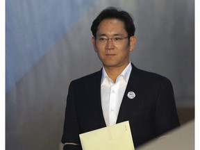 FILE - In this Feb. 5, 2018, file photo, Lee Jae-yong, vice chairman of Samsung Electronics, arrives at the Seoul High Court for a hearing in Seoul, South Korea. South Korean President Moon Jae-in heads to his meeting with North Korea's leader with a huge civilian entourage including the third-generation heir of South Korea's largest business group and a Colorado-born pop diva nicknamed the "Korean Beyonce." The inclusion of billionaire Samsung scion Lee Jae-yong in the South Korean delegation has been a controversial decision as he has been a key figure in the corruption scandal surrounding former South Korean President Park Geun-hye.