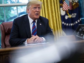 .S. President Donald Trump speaks during a phone conversation with Enrique Pena Nieto, Mexico's president, not pictured, in the Oval Office of the White House in Washington, D.C., U.S., on Monday, Aug. 27, 2018.