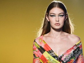 Model Gigi Hadid presents a creation for Versace fashion house during the Women's Spring/Summer 2019 fashion shows in Milan in September.