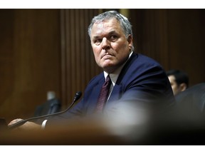 FILE - In this June 28, 2018, file photo Charles Rettig listens to a question during a Senate Finance Committee hearing on his nomination for Internal Revenue Service Commissioner on Capitol Hill in Washington. The Senate voted 64-33 on Sept. 12 to confirm the Beverly Hills tax attorney as IRS commissioner.