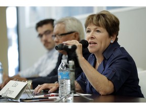 FILE - In this July 17, 2018, photo, Lisa Brown, the Democratic opponent to Rep. Cathy McMorris Rodgers, R-Wash., speaks during a candidates forum in Colfax, Wash. Some Democratic candidates are determined not to let Republican members of Congress distance themselves from the president's trade policies. Their efforts play into voter concerns that Congress should be more of a check on Trump. Republicans hope that a strong economy carries them to victory.