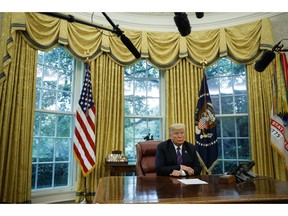 In this Aug. 27, 2018, photo, President Donald Trump listens during a phone call with Mexican President Enrique Pena Nieto about a trade agreement between the United States and Mexico, in the Oval Office of the White House. Trump is making trade policy the connective tissue that ties together his "America First" foreign policy and his political strategy for the 2020 presidential election.
