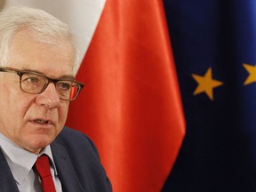 Poland's Foreign Minister Jacek Czaputowicz says that President Andrzej Duda will discuss boosting the U.S. military presence in Poland and greater U.S. economic involvement when he is hosted by President Donald Trump at the White House next week, during an interview for the Associated Press in Warsaw, Poland, Friday, Sept. 14, 2018.