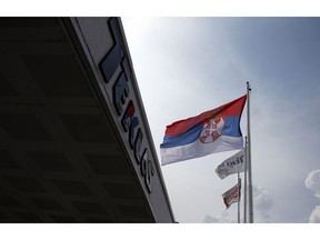 In this photo taken Friday, Aug. 31, 2018, a Serbian flag flutters at the Turkish Teklas Automotive plant in Vladicin Han, Serbia. The fall of the Turkish lira has raised concerns over the future of Turkish businesses in the investment-hungry Balkans.