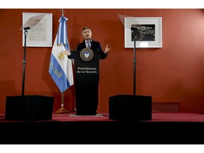 Argentina's President Mauricio Macri speaks from the government house in Buenos Aires, Argentina Thursday, Sept. 27, 2018. Argentina has been hit by a severe drought, one of the world's highest inflation rates and a sharp depreciation of its currency, which has lost more than half its value against the dollar so far this year. That has forced the government to reach out to the IMF for help.