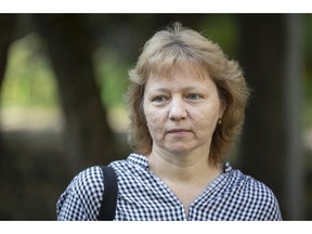 In this photo taken on Tuesday, Sept. 4, 2018, Marina Grigoryeva, 52, speaks during an interview to the Associated Press in Moscow, Russia. Grigoryeva, who has worked for the Moscow City Telephone Network for nearly 30 years, has been out of job since February and knows that work for 50 year olds is hard to be come by. Before, she was thinking that she could rely on the old-age pension that would kick in in three years.