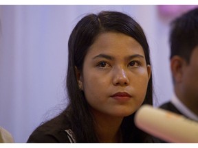 Chit Su Win, wife of Reuters journalist Kyaw Soe Oo, listens to questions during a press briefing at a hotel Tuesday, Sept. 4, 2018, in Yangon, Myanmar. A Myanmar court sentenced two Reuters journalists to seven years in prison Monday on charges of illegal possession of official documents, a ruling met with international condemnation that will add to outrage over the military's human rights abuses against Rohingya Muslims.