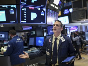 A trader works on the floor on the New York Stock Exchange.